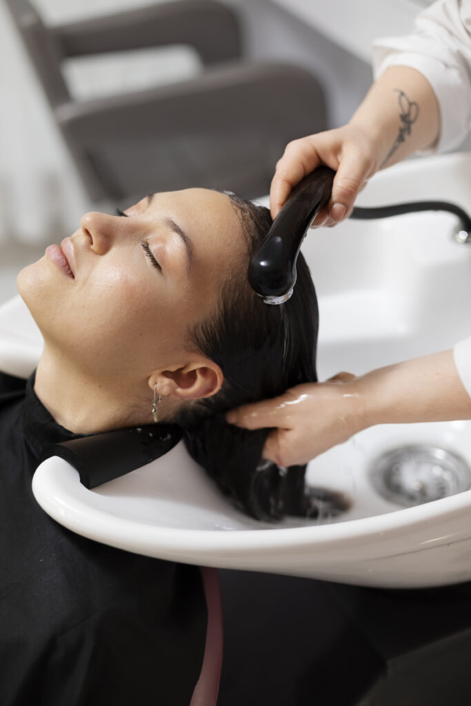 woman-getting-treatment-hairdresser-shop